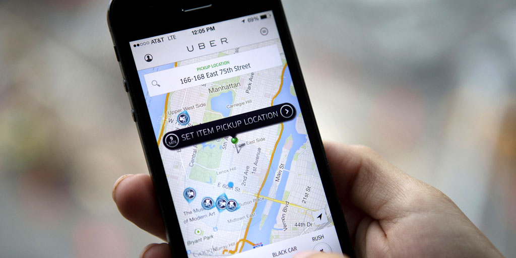 Th Uber Technologies Inc. car service application (app) is demonstrated for a photograph on an Apple Inc. iPhone in New York, U.S., on Wednesday, Aug. 6, 2014. For San Francisco-based Uber Technologies Inc. which recently raised $1.2 billion of investors' financing at $17 billion valuation, New York is its biggest by revenue among the 150 cities in which it operates across 42 countries. The Hamptons are a pop-up market for high-end season weekends where the average trip is three time that of an average trip in New York City. Photographer: Victor J. Blue/Bloomberg via Getty Images