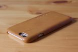 Mujjo Leather Case in Tan with an iPhone 6 inside top left angle