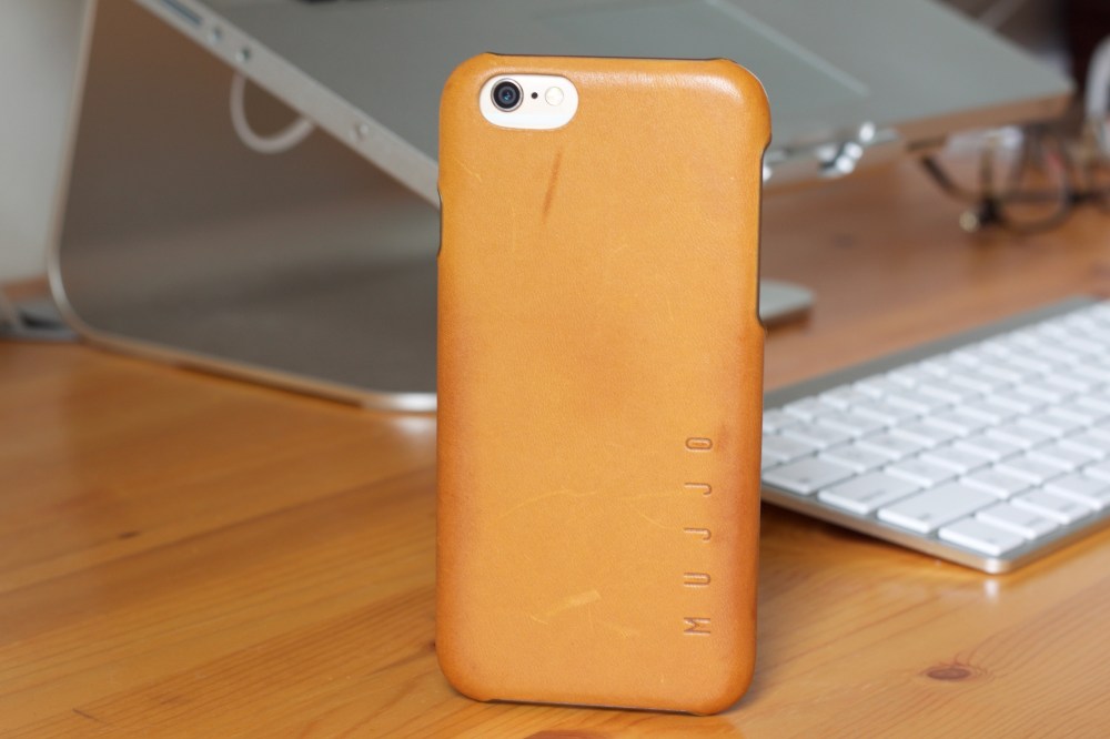 Mujjo Leather Case in Tan with an iPhone 6 propped vertically in front of a keyboard