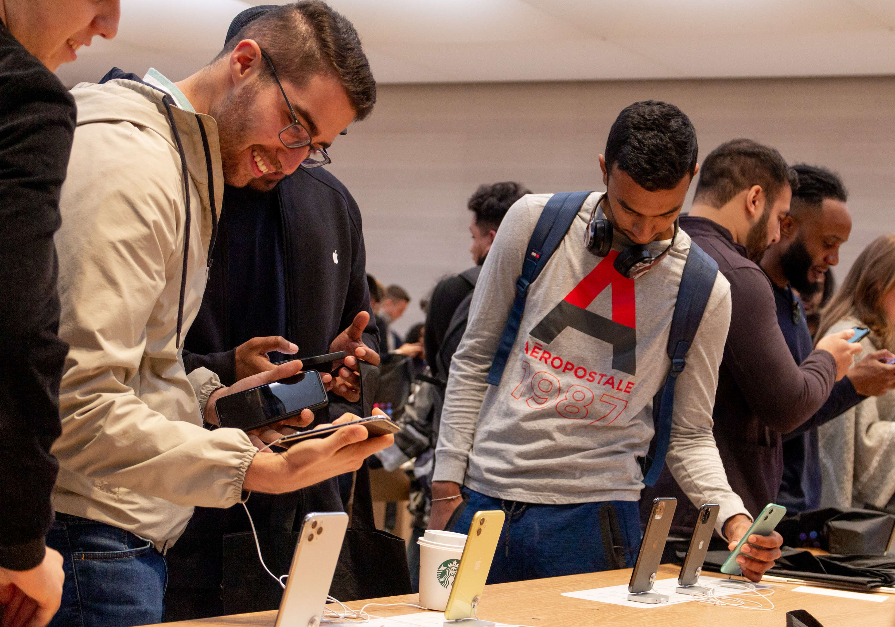 Customers explore iPhone 11 at Apple Fifth Avenue