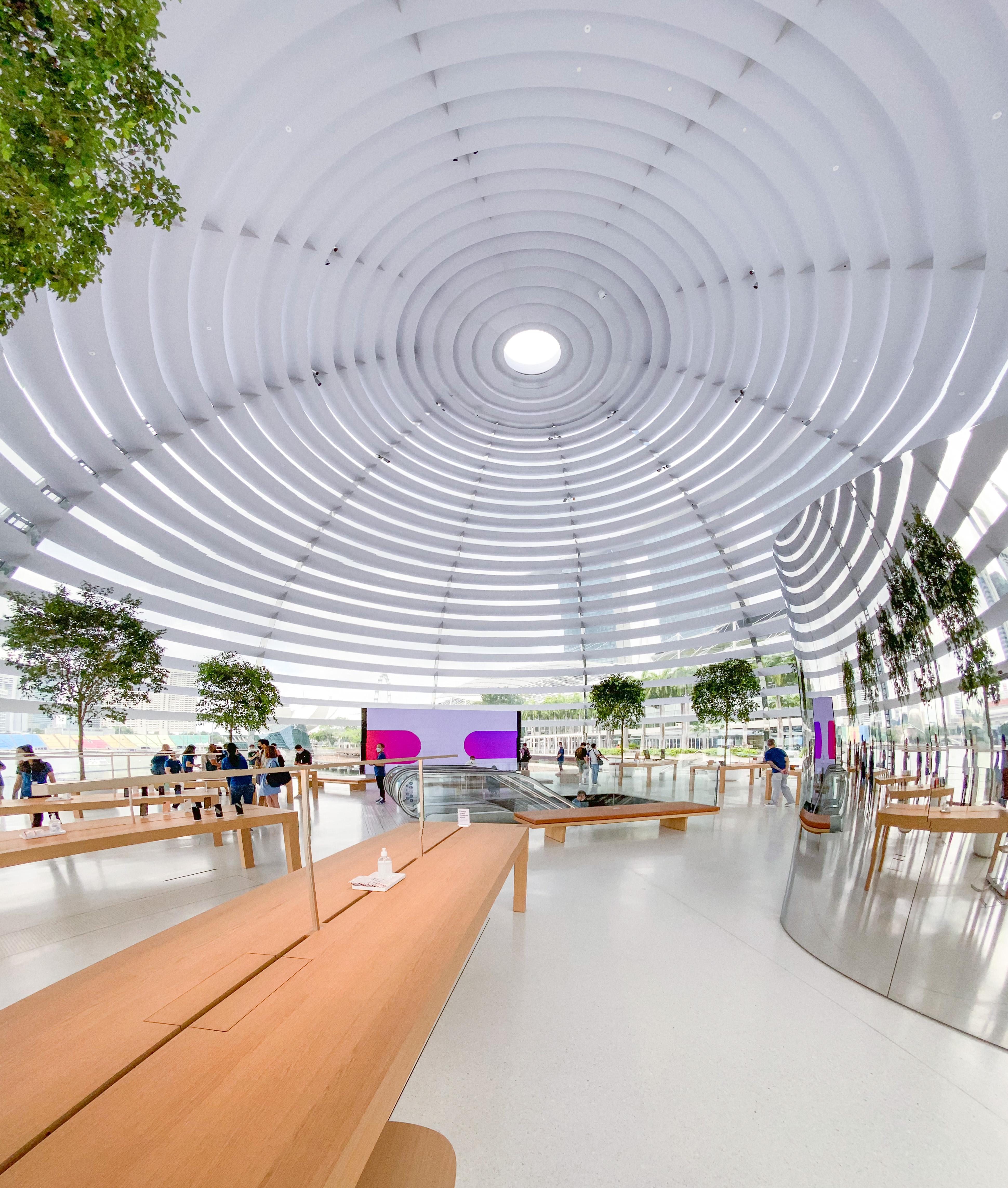 Aug. 28, 2020, Singapore, Republic of Singapore, Asia - View of the new  Apple flagship store on the waterfront in Marina Bay Sands with the  business district skyline in the background. The