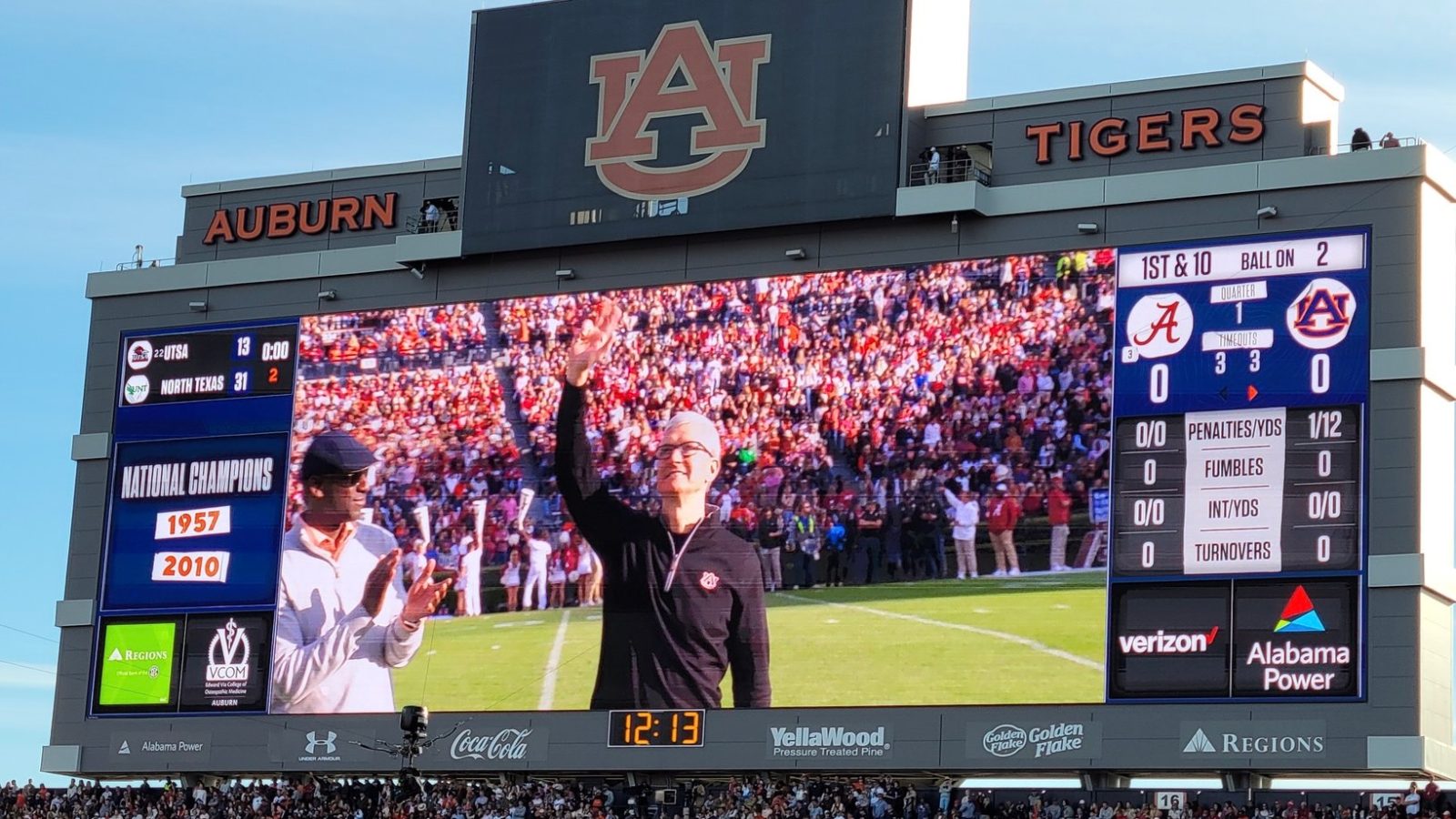 photo of Tim Cook honored with Auburn ‘Captains of Industry Award,’ attends Auburn vs Alabama football game image