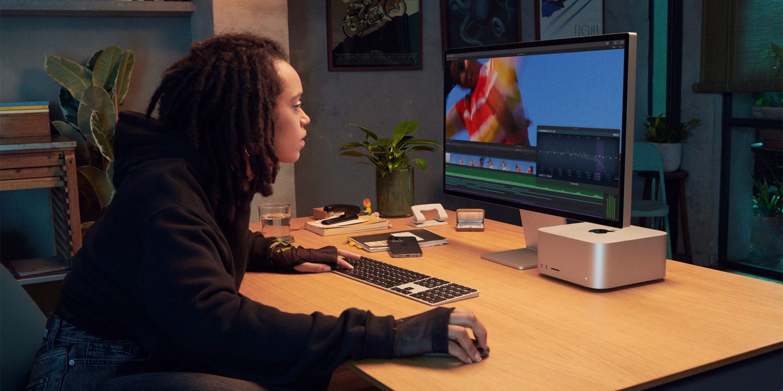 Woman using Mac Studio to edit video | Mac shipments grew 8% this year as big PC brands fell