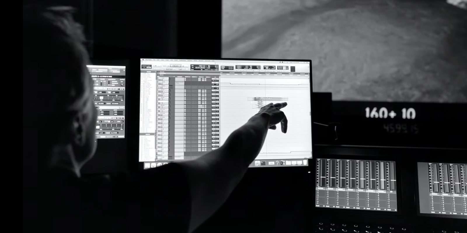 Woman points to audio tracks on a Mac as Star Wars video plays on larger screen behind | How Macs helped create the Star Wars sound design