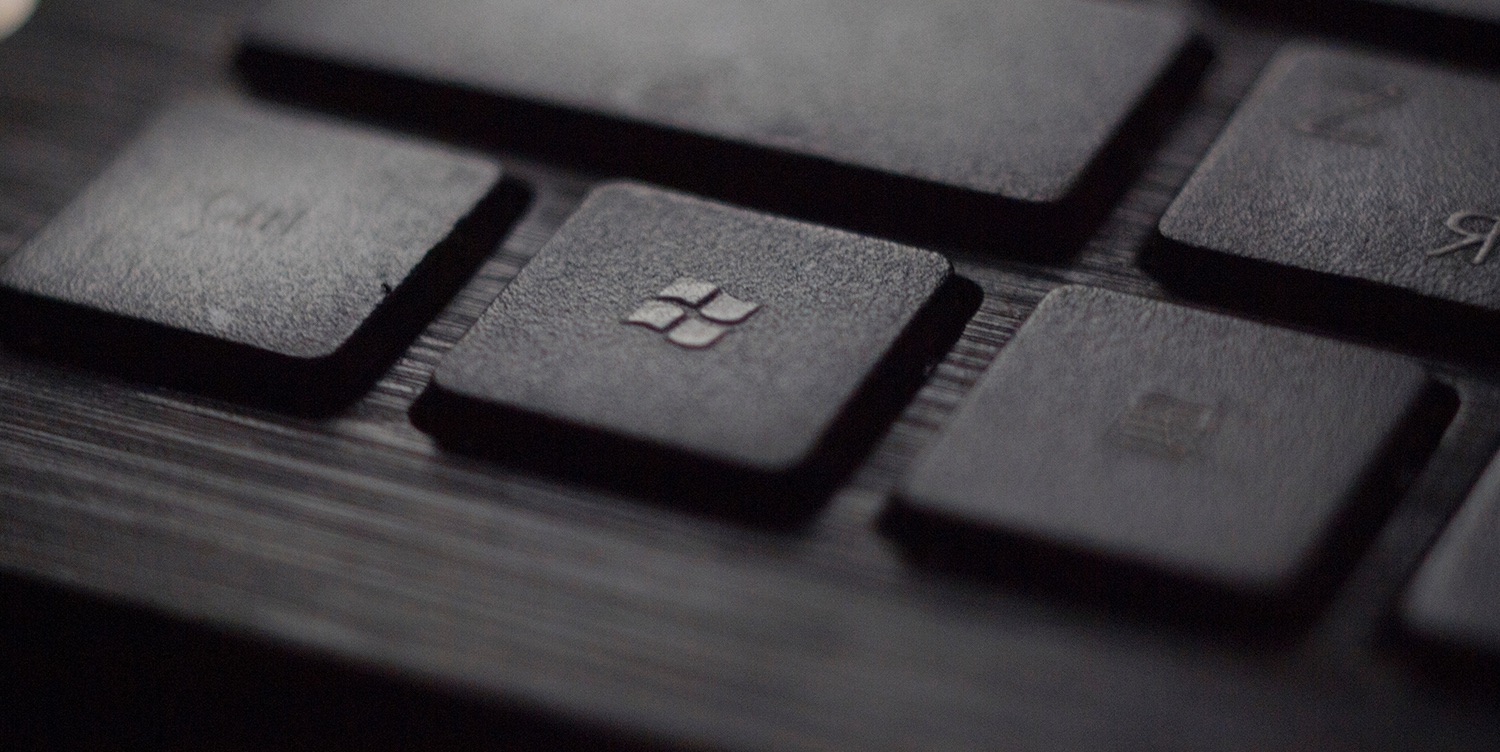 Microsoft union | Black keyboard close-up showing Windows logo