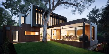 Smart home tech | Exterior of modern home at dusk