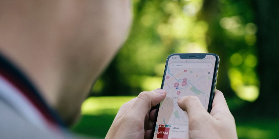Photo shows a man using a map on an iPhone | Your online behavior and location is shared with advertisers 747 times a day