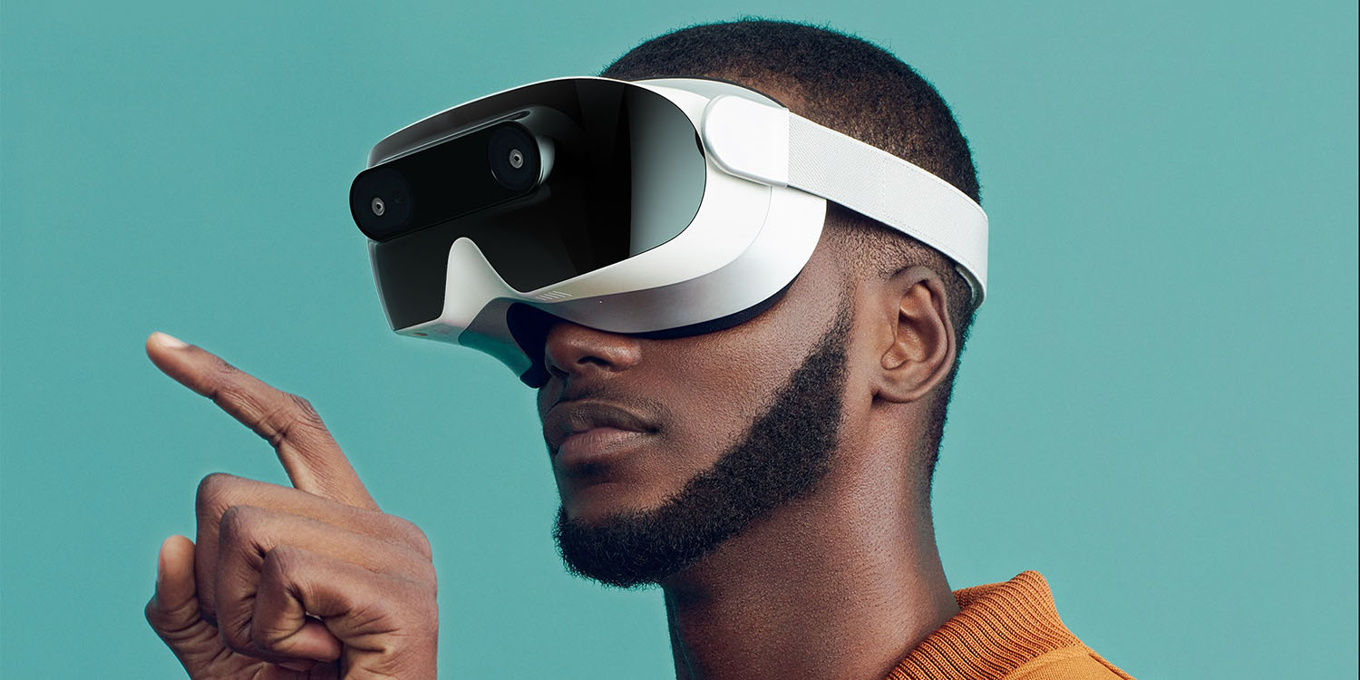 Apple headset launch date | Man wearing VR headset and touching something in virtual world