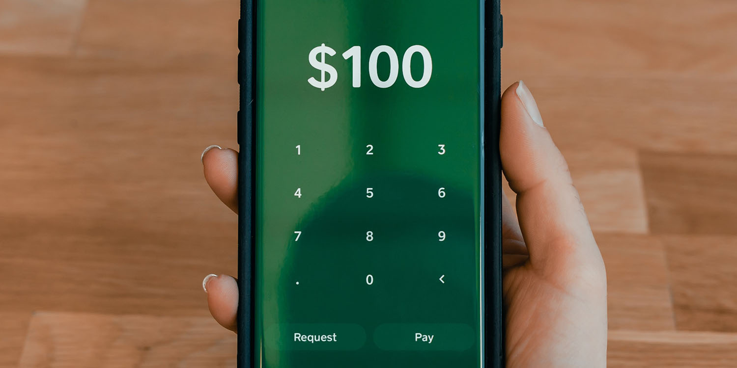 Cash app scams | Smartphone with cash transfer in progress