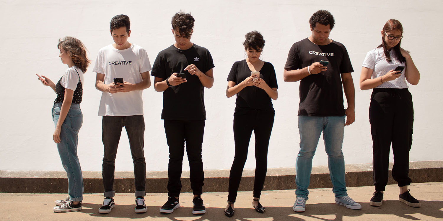 Depressing study | Group of young adults all staring at their phones