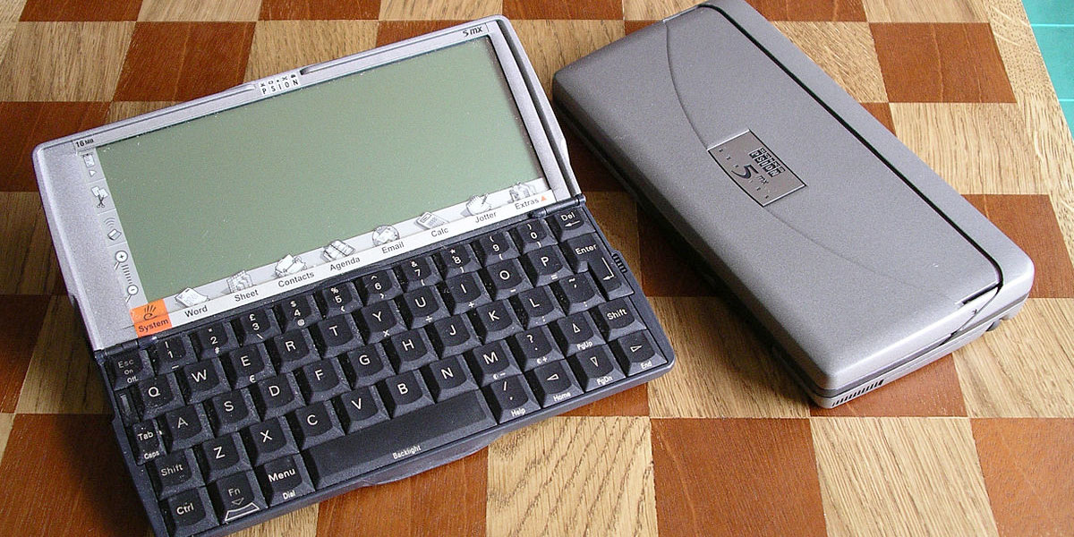 Life before iPhone | Two Psion 5mx PDAs on chessboard, one open, closed