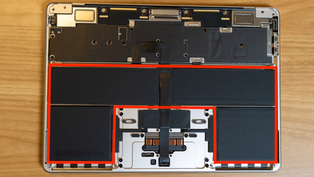 Inside of the M2 MacBook Air, with the battery outlined in red