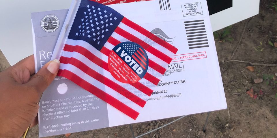 Midterm election disinformation | US flag and ballot envelope