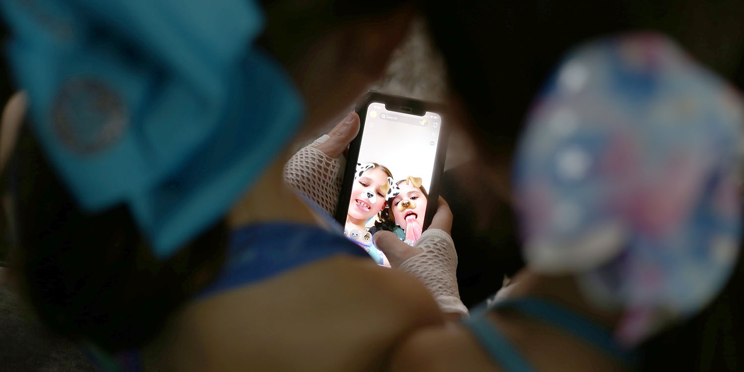 Snapchat parental controls | Children taking selfie