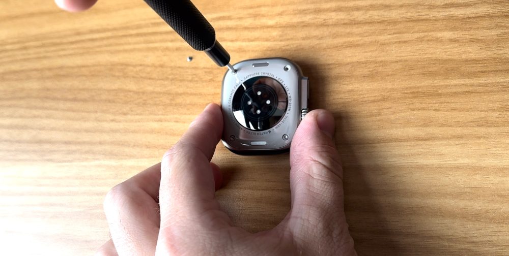 Screwing the back of the Apple Watch Ultra