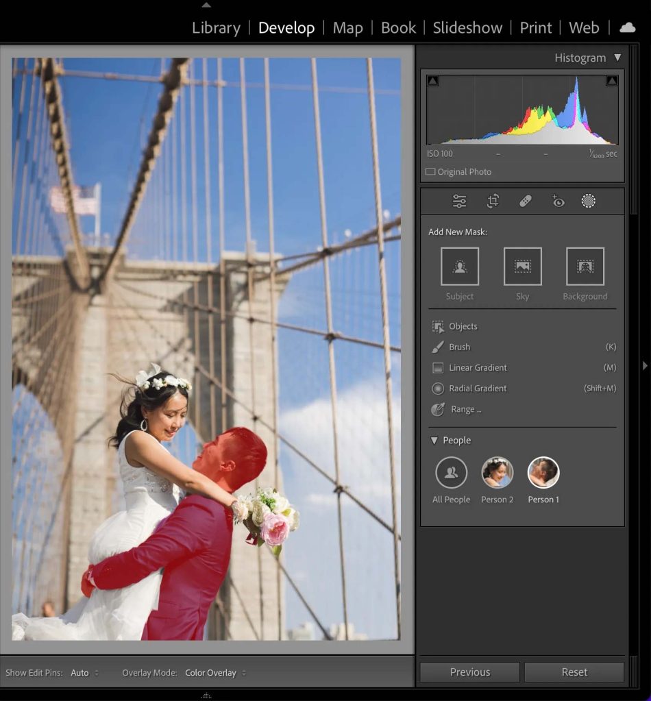 Photo of a wedding couple on a bridge with the groom selected with the new Select People tool in Adobe Lightroom