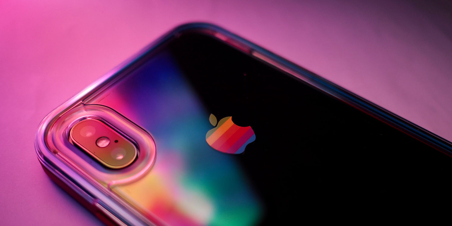 Third-party app stores deadline | iPhone in case with rainbow Apple logo