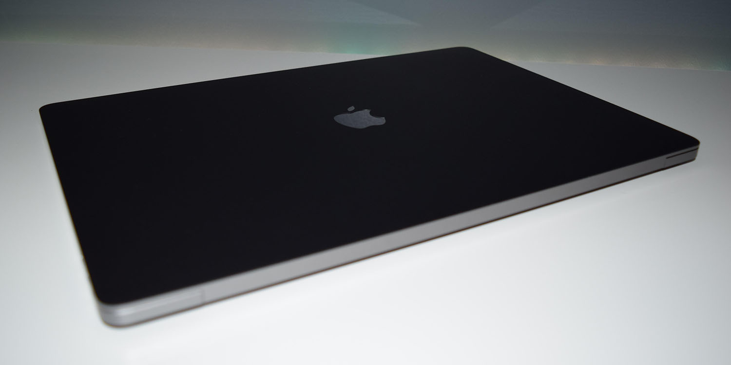 Matte black MacBook | dBrand skin shown