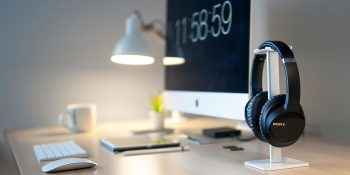 Spotify comment on Apple | Headphones next to iMac on desk