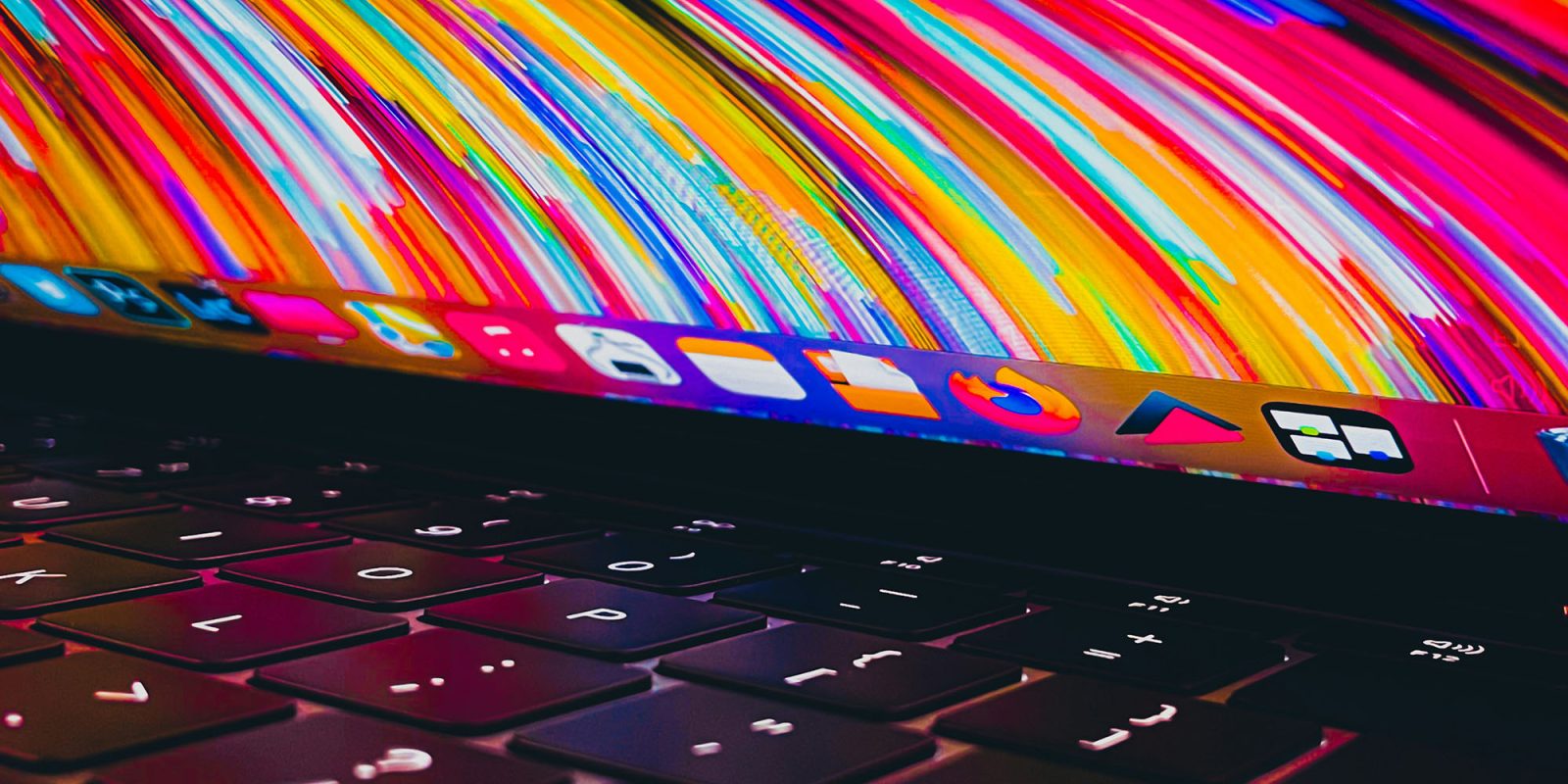 Unpatchable security flaw in Apple Silicon Macs | MacBook with chaotic colorful wallpaper