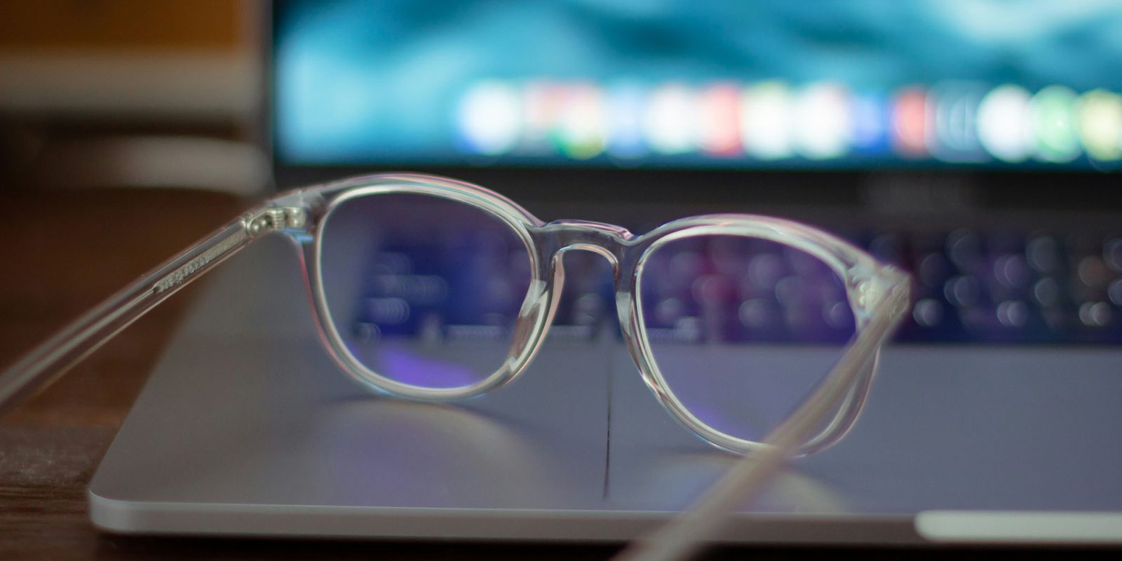 Apple's ad transparency tools Mozilla | Eyeglasses resting on MacBook