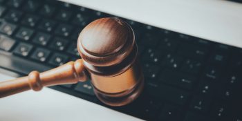 Billion dollar developer lawsuit will proceed | Court gavel on keyboard