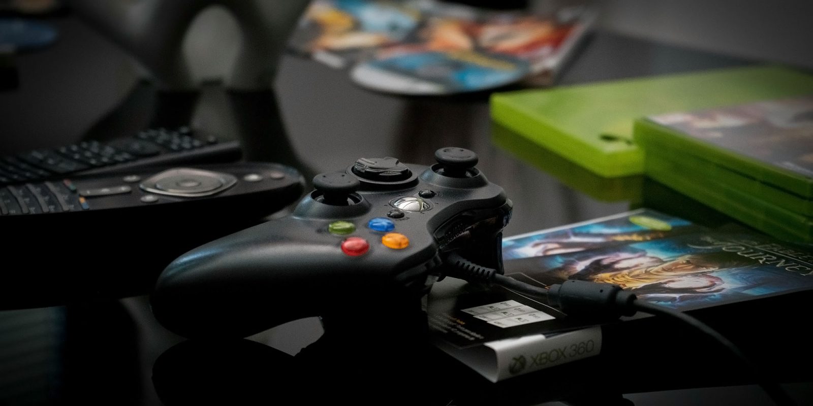 Microsoft iOS app store | Game controller on desk with games