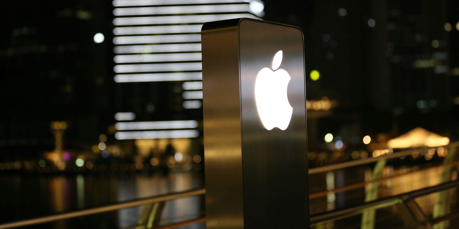 Next Apple antitrust battle looming | Photo shows glowing Apple logo outside a retail store