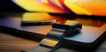 Replacing the iPhone remains a stretch but AI is key | iPhone and Watch on a MacBook