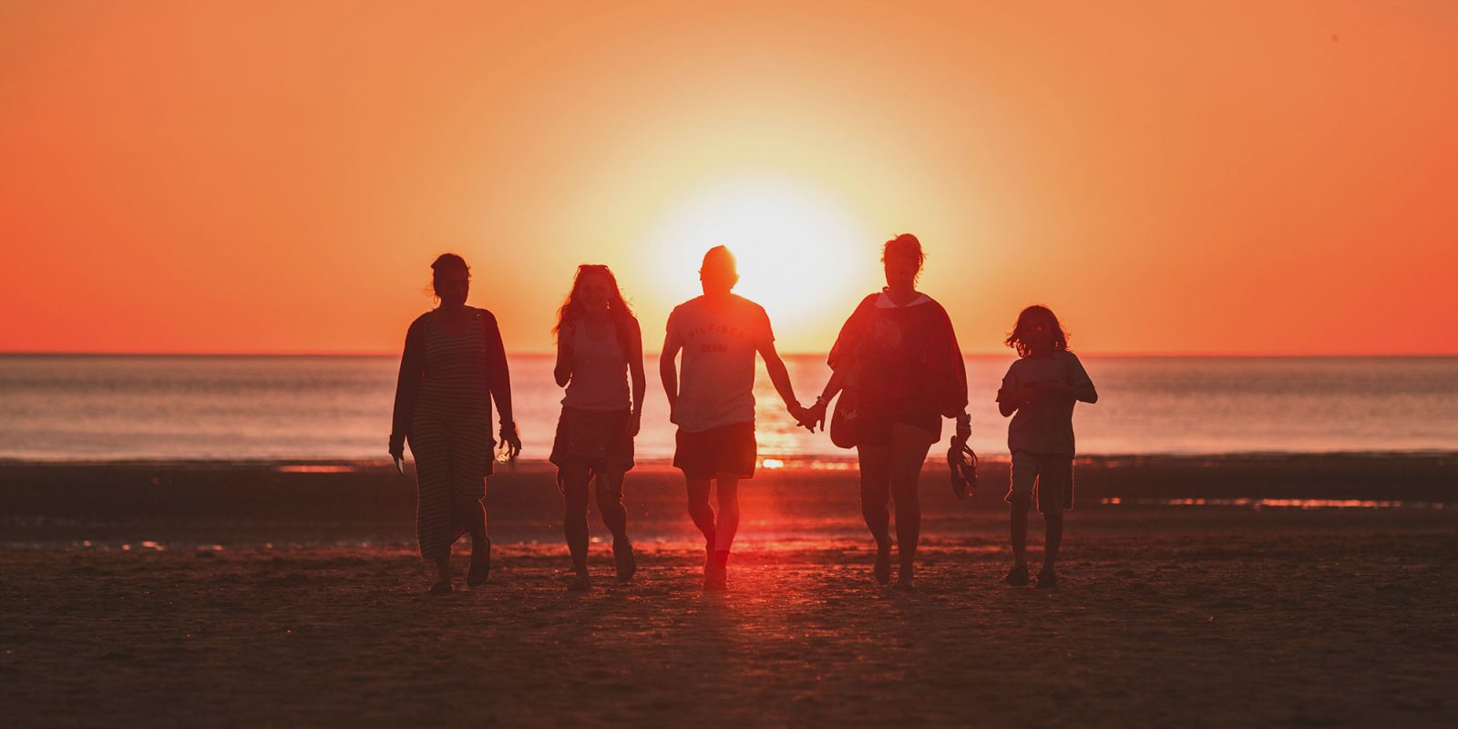 1Password for Families | Family on a beach at sunset