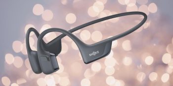 Shokz OpenRun Pro 2 review | Product shot against a blurred fairy light background