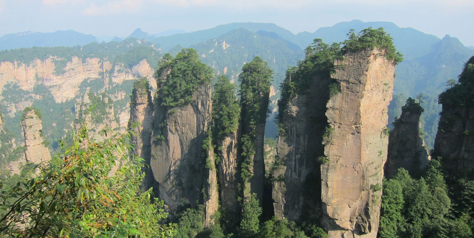 Apple supporting national parks initiative in China | Photo of rock columns and forest