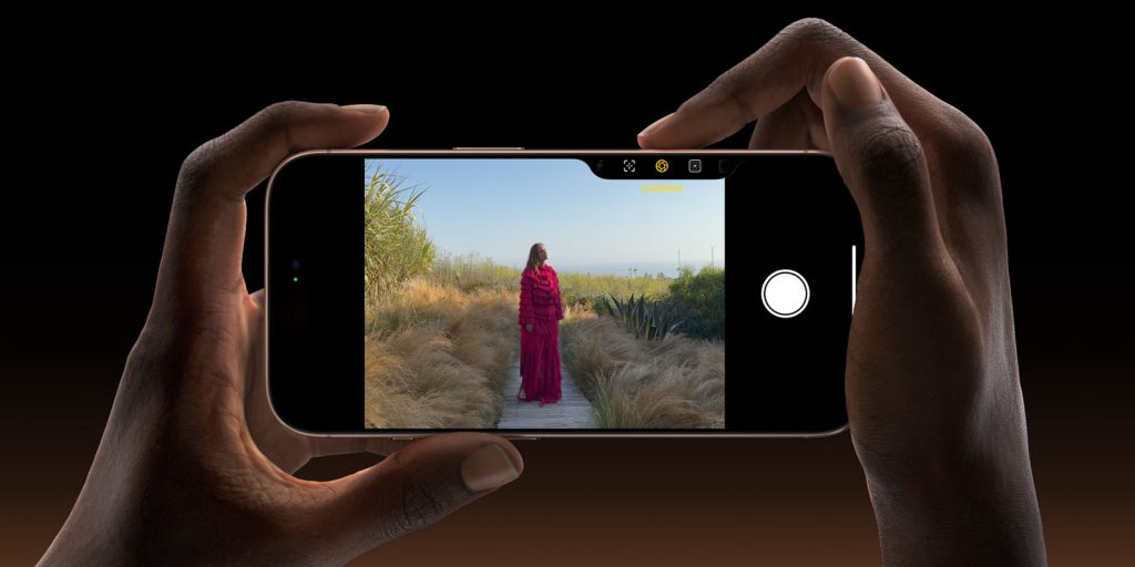 iPhone 16 designers share the thinking behind the Camera Control button | Close-up of using the button to choose the lens