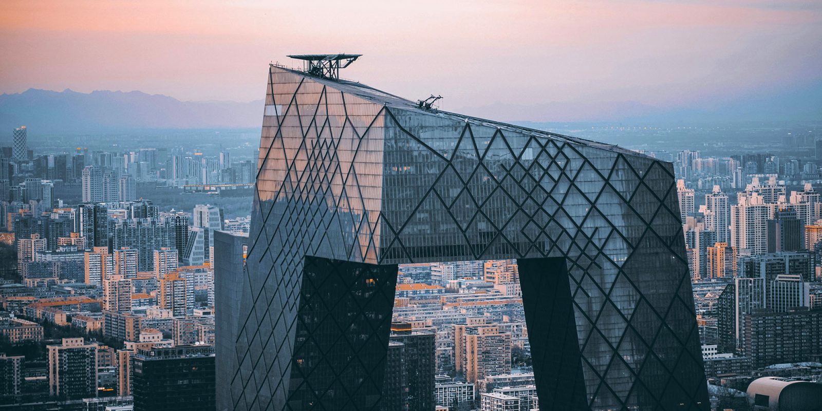 iPhone sales in China fell for the 4th month in a row | Modern building in Beijing skyline