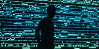 Meta AI app 'a privacy disaster' as chats inadvertently made public | Person silhouetted against Matrix-style screen