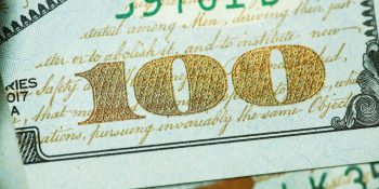 Paid subreddits plan on hold as company prioritizes search engine plans | Close-up of $100 bill