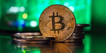 New study shows 'massive spike' in fraudulent apps powered by AI | Image shows Bitcoin against colorful background