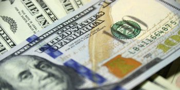 Apple's Services division is now bigger than Walt Disney or Tesla – FT | Close-up of a $100 bill