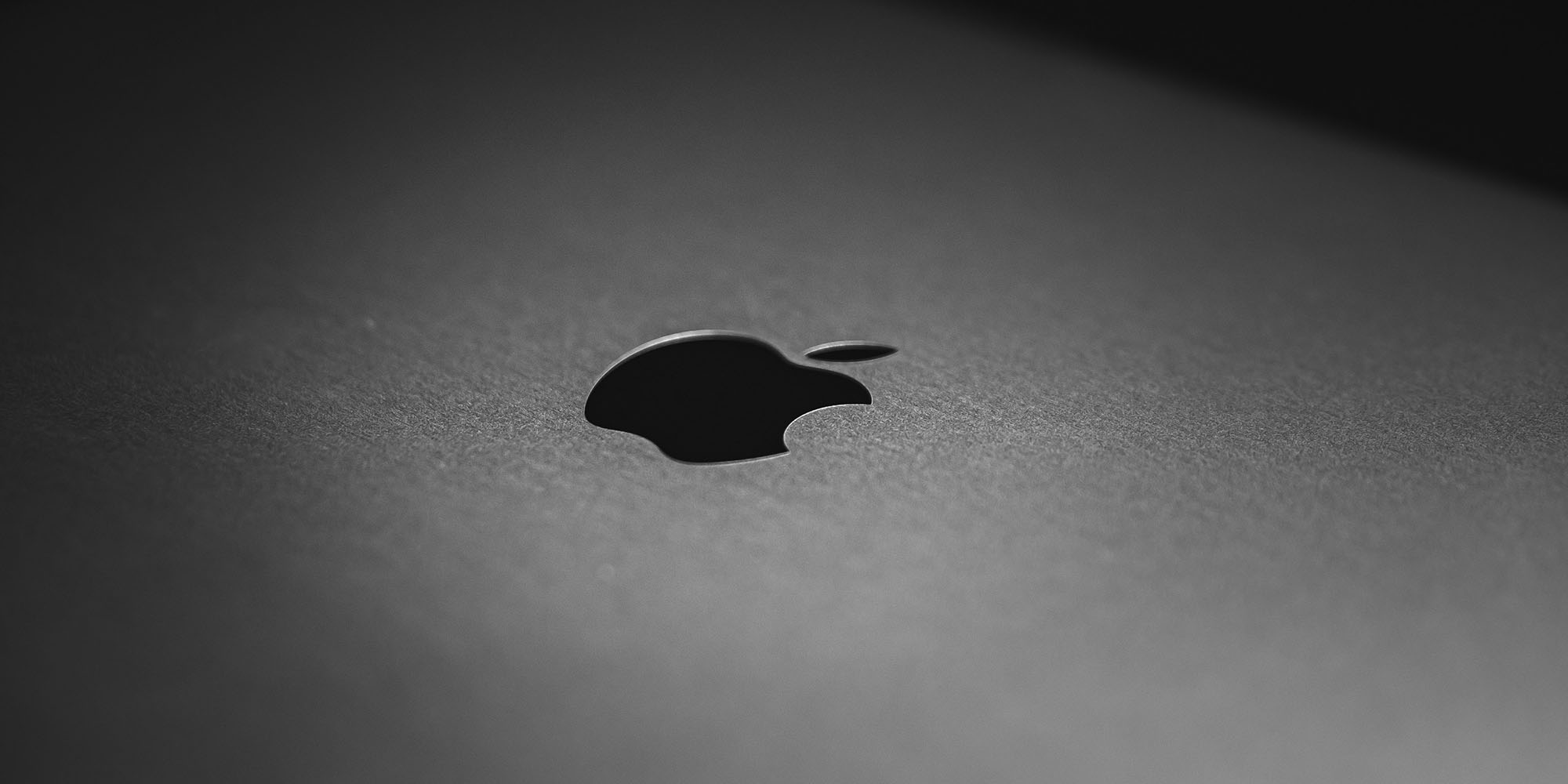 My return to being a two-Mac guy really worked out for me | Close-up of the Apple logo on a Mac