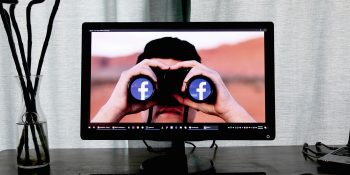 AI companies and data brokers sell our personal data even when told not to | Image shows a pair of binoculars with Facebook logos in the lenses
