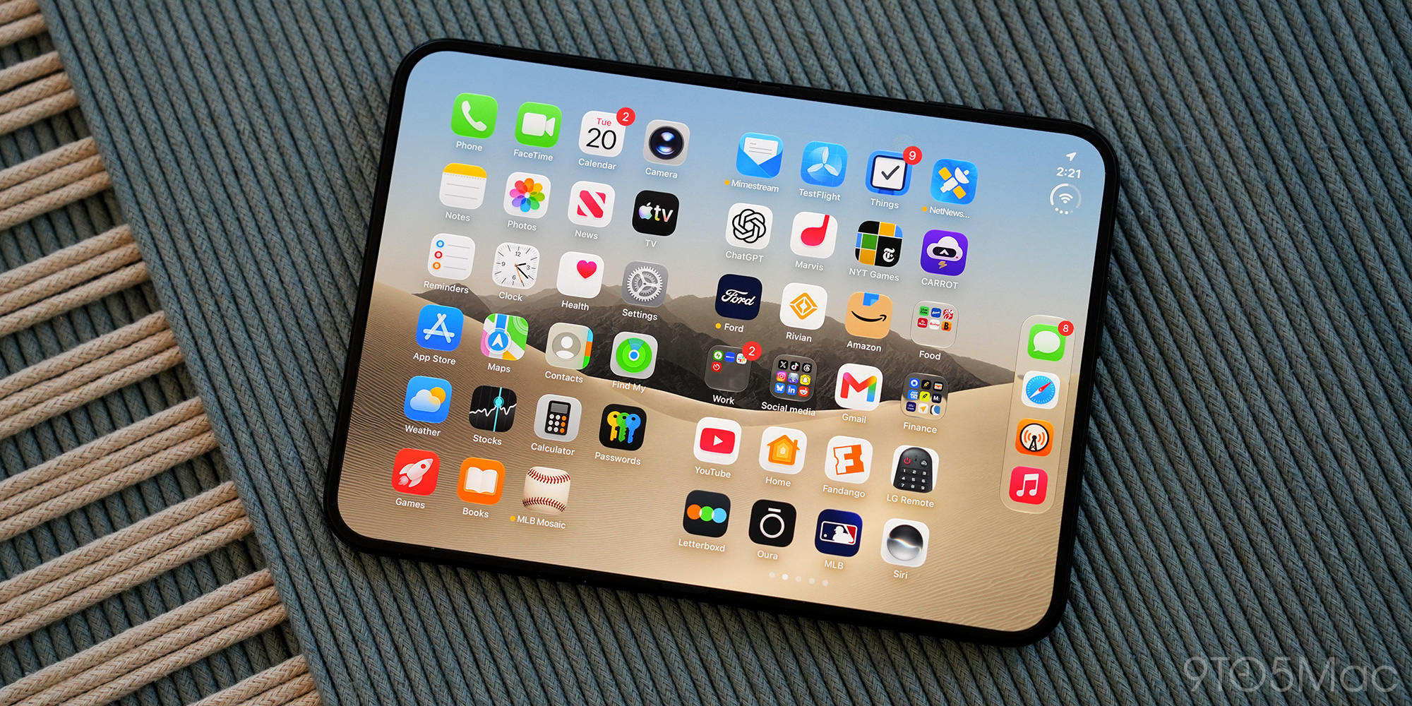 Apple reportedly boosts iPhone Duo orders by more than 40% given strong demand | Photo shows an open iPhone Duo on a mat